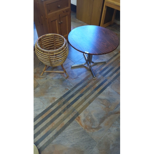 300 - Round wooden-top table with chrome pedestal base and vintage-style bamboo basket.