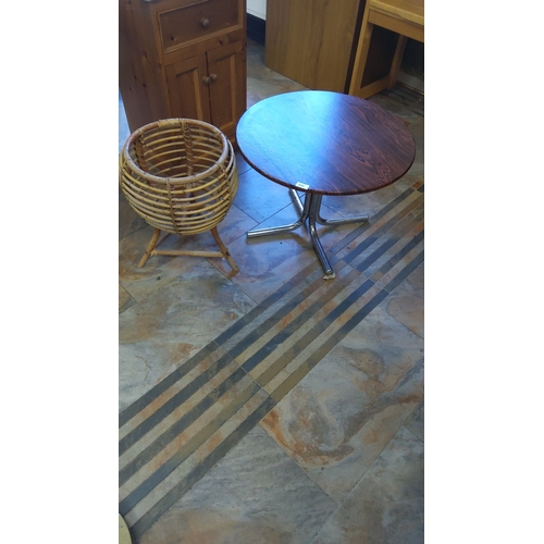 300 - Round wooden-top table with chrome pedestal base and vintage-style bamboo basket.