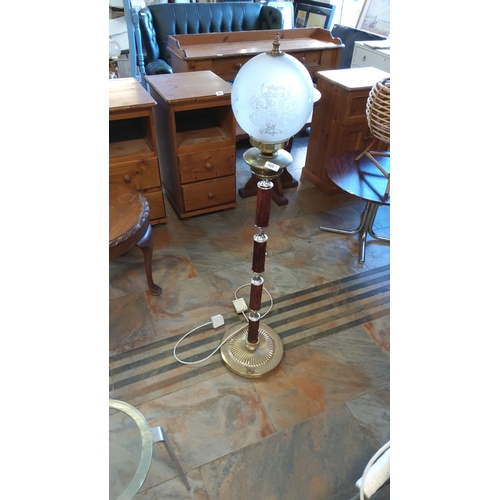 305 - Vintage floor lamp with etched frosted glass globe, brass accents, and wood-effect column detailing.... 