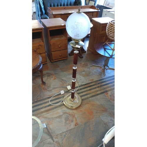 305 - Vintage floor lamp with etched frosted glass globe, brass accents, and wood-effect column detailing.... 