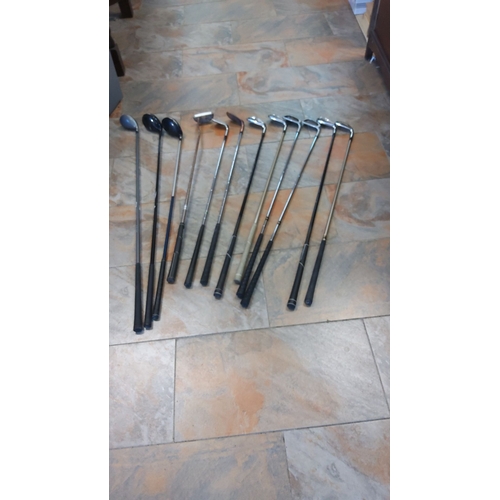 310 - Mixed collection of golf clubs, including drivers, irons, and putters. Steel shafts and original gri... 