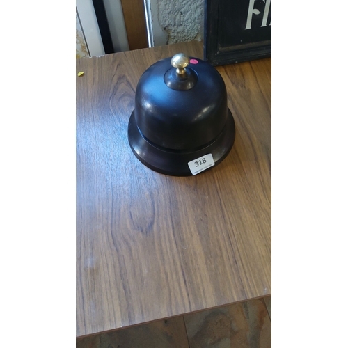 318 - Vintage brass and black cast hotel service bell, from the mid-20th century, features a sleek dome de... 