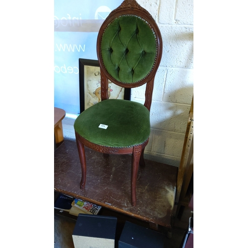 324 - Victorian-style mahogany chair, carved floral detailing, upholstered in deep green tufted velvet, el... 