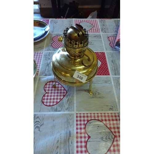 348 - Brass oil lamp with ornate burner and three-legged stand, from the mid-20th century.