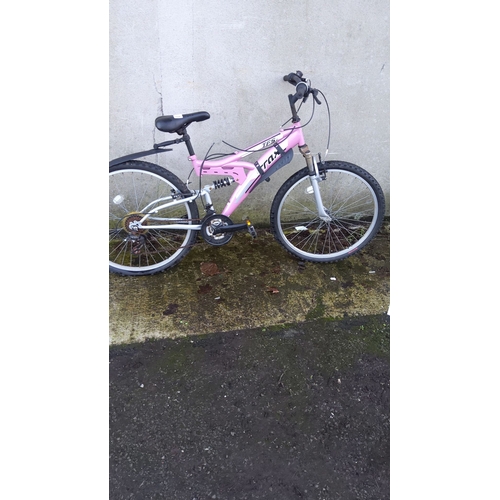 466 - Vintage pink mountain bike, model T65. Features durable frame and all-terrain tires.