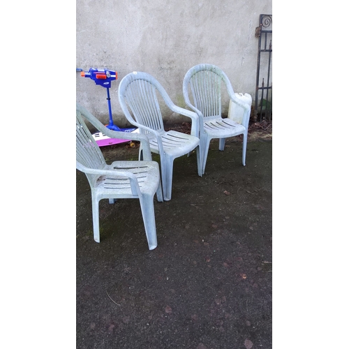 468 - 3 outside plastic chairs