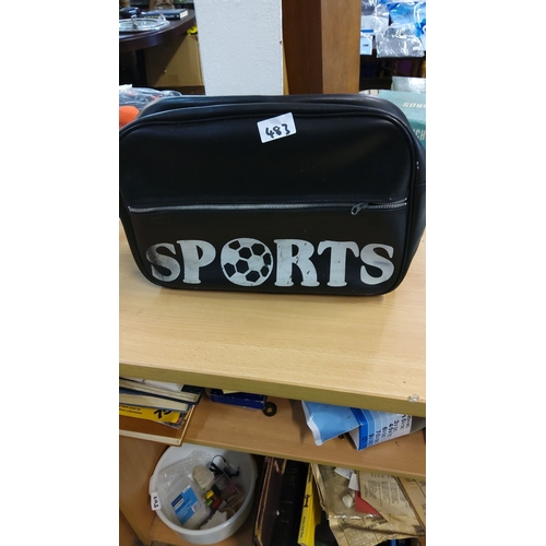 483 - Classic black vinyl sports bag adorned with bold 