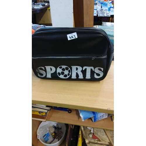 483 - Classic black vinyl sports bag adorned with bold 