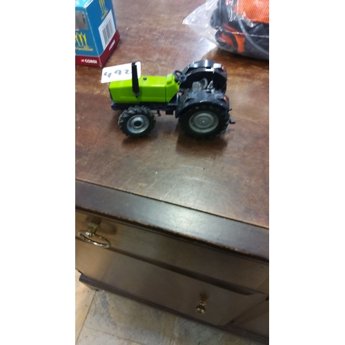 492 - Vintage Corgi Diecast Model Tractor, bright green with black accents, rubber tires, and detailed con... 