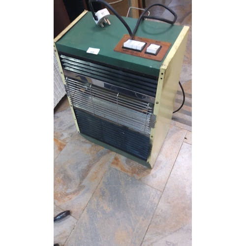 68 - Vintage electric heater, circa 1970s, features a robust green and yellow design. It is fully functio... 