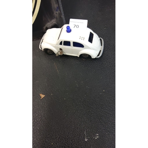 70 - Vintage wind-up tin police car, white with blue detailing, functional key mechanism, mid-20th centur... 