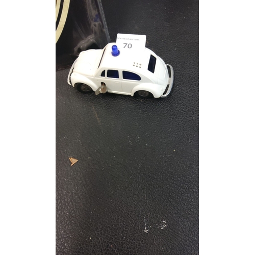 70 - Vintage wind-up tin police car, white with blue detailing, functional key mechanism, mid-20th centur... 