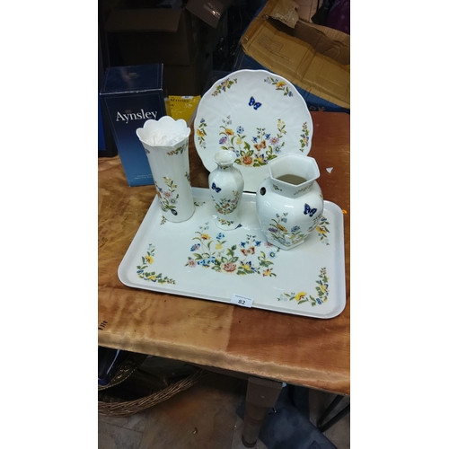 82 - Aynsley bone china floral and butterfly collection includes plastic tray, vases, pitcher, and plate.... 