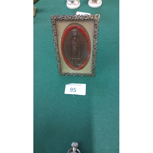 95 - Antique-style metal frame houses a red-bordered religious medallion with intricate detailing, from t... 