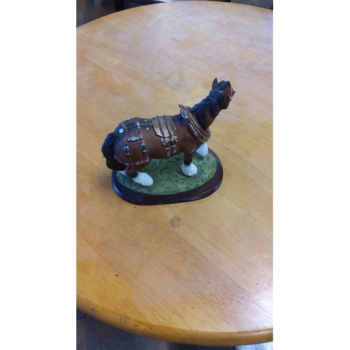 11 - Hand-painted Juliana resin draft horse figurine, detailed tack and harness, mounted on a wooden base... 