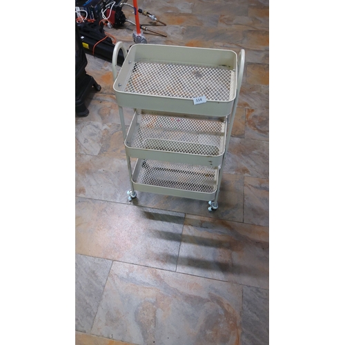 114 - Three-tier rolling metal utility cart with mesh shelves, cream finish, and sturdy casters.