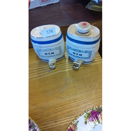 176 - Pair of vintage ceramic Gin barrels, blue-banded with ornate printed motifs, featuring spouts