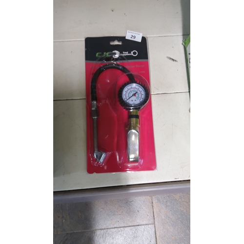 29 - Precision tire pressure gauge with flexible hose and ergonomic grip.