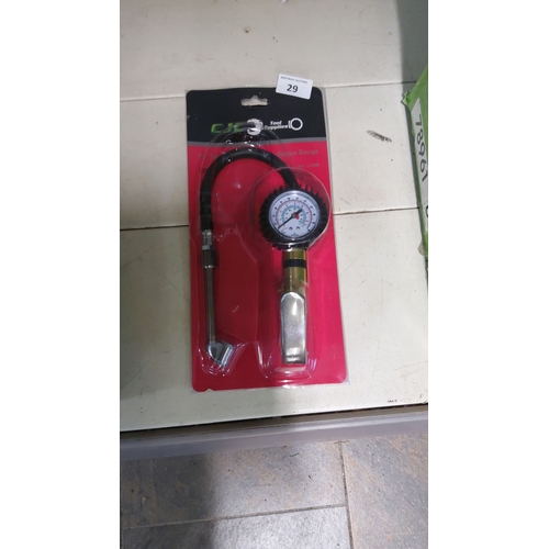 29 - Precision tire pressure gauge with flexible hose and ergonomic grip.