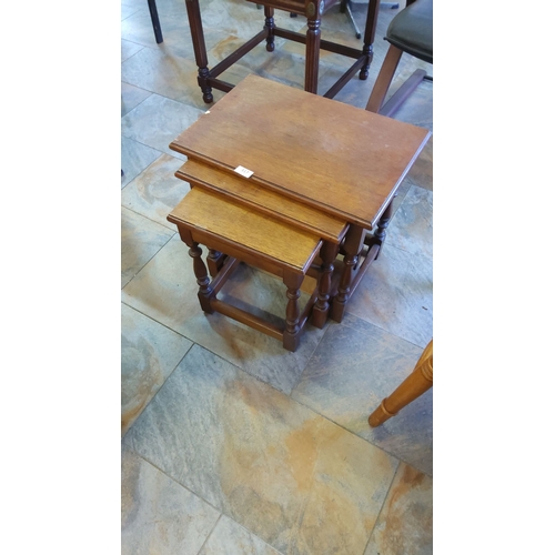 317 - Three-tier vintage nesting table set made of solid oak with turned spindle legs, from the mid-20th c... 