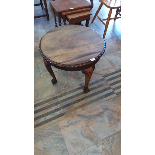 319 - Antique Edwardian mahogany circular occasional table features claw-and-ball feet and a foliate carve... 