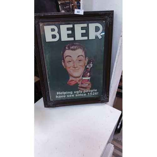 40 - Vintage-style beer advertisement in an ornate wooden frame. Features a humorous mid-century design w... 