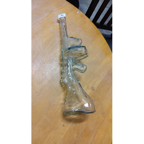 41 - Clear glass novelty decanter shaped as a rifle, from the mid-to-late 20th century. Unique conversati... 