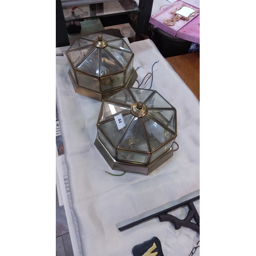 44 - Pair of vintage brass and glass octagonal ceiling lights with beveled glass panels.