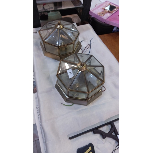 44 - Pair of vintage brass and glass octagonal ceiling lights with beveled glass panels.