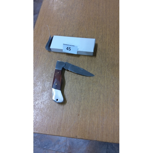 45 - Folding pocket knife with wood handle and stainless steel accents. Includes original box.