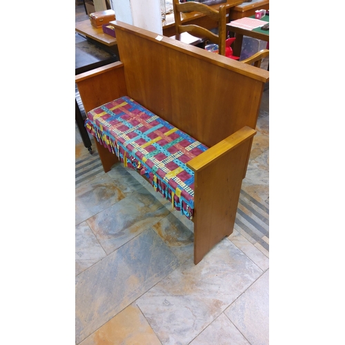 67 - Mid-century wooden church pew bench features clean lines and a natural wood finish. It includes an u... 