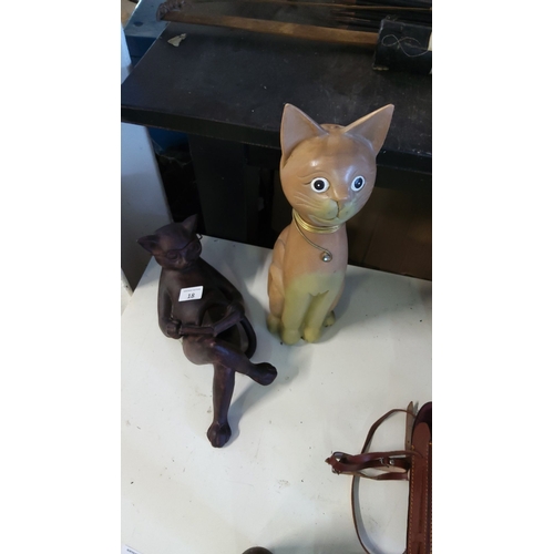 18 - Ceramic cat figurines duo includes a seated cat with glasses in a reading pose and a standing cat wi... 