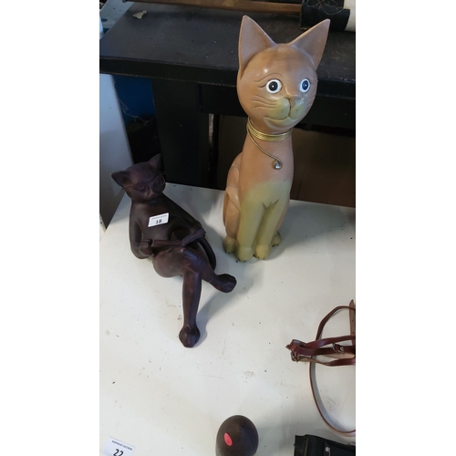 18 - Ceramic cat figurines duo includes a seated cat with glasses in a reading pose and a standing cat wi... 