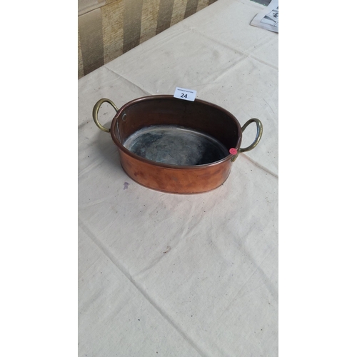 24 - Vintage copper oval pan with brass handles.From the mid-20th century.