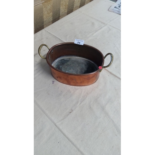 24 - Vintage copper oval pan with brass handles.From the mid-20th century.