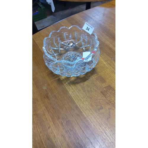 34 - Waterford Crystal bowl with scalloped rim and starburst design base. Diameter is approximately 8 inc... 