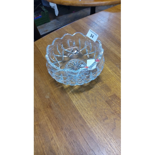 34 - Waterford Crystal bowl with scalloped rim and starburst design base. Diameter is approximately 8 inc... 