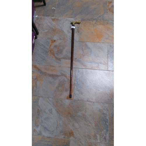 40 - Vintage wooden walking cane with brass T-handle, from the mid-20th century. Features sturdy construc... 