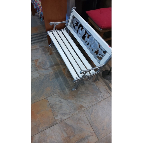 65 - Child size Cast-iron and wood outdoor bench features an animal-themed backrest and has been refurbis... 