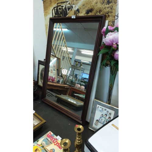 68 - Large wooden-framed wall mirror with a classic mahogany finish