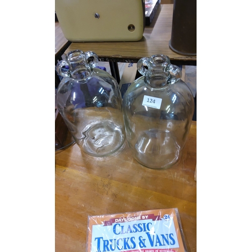 124 - Pair of vintage clear glass demijohns with twin-handled rims.