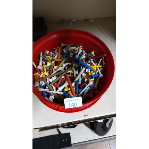 140 - Large assorted lot of vintage and modern golf tees in various colors and materials.