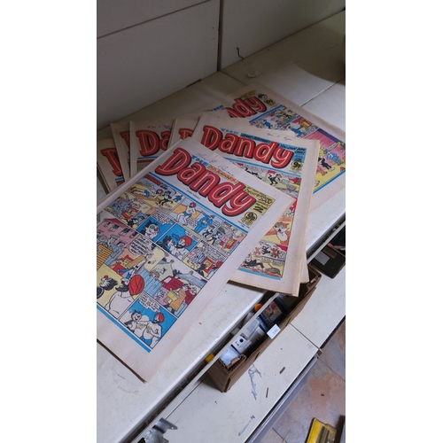 142 - Vintage **Dandy** comic books feature classic British humor and beloved characters.(12)