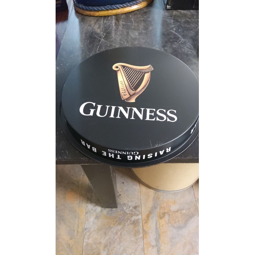 153 - Guinness original serving tray featuring the iconic harp logo and “Raising the Bar” text.