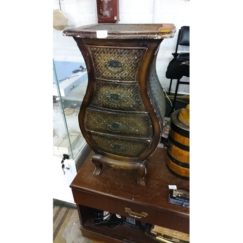 159 - Vintage bombe-style chest of drawers features four woven rattan-front drawers, ornate metal handles,... 