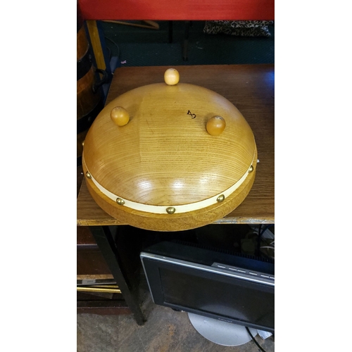 162 - Turned Wooden bowl with brass stud accents. Features smooth, natural wood grain