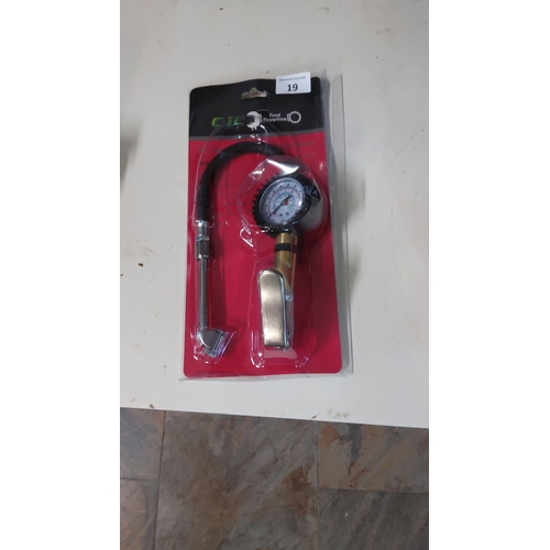 19 - Professional-grade tire pressure gauge with hose and metal inflation trigger. New in packaging.