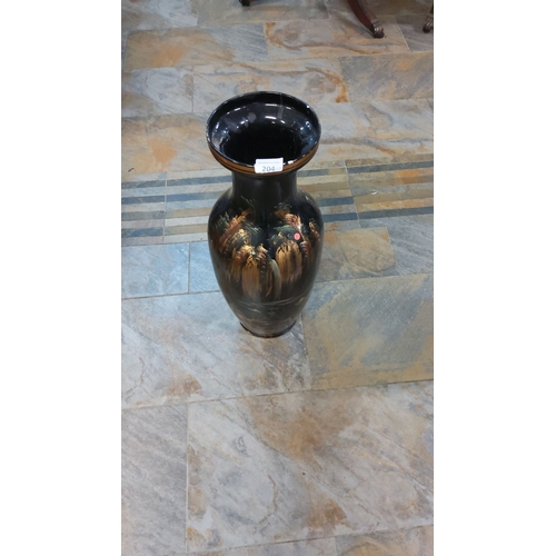 204 - Hand-painted ceramic floor vase features a glossy black glaze with gold-toned landscape detailing an... 