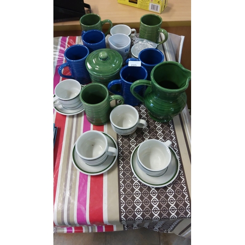 205 - Large assorted ceramic tableware lot, including glazed green and blue mugs, lidded pot, pitcher, and... 