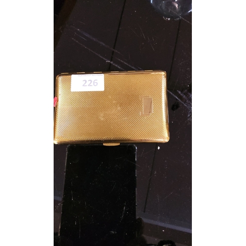 226 - Vintage gold-tone cigarette case features an elegant engine-turned pattern. It has a hinged design w... 